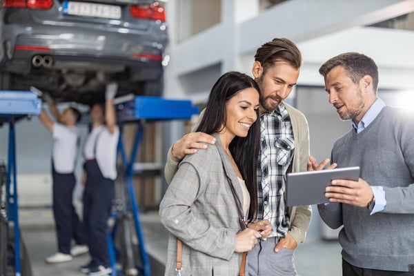Salesperson with a tablet in service department